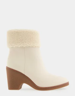 Comfortable Women's Faux Shearling Cuff Sculpted Wedge Crepe Heel Bootie in Eggnog Pebbled Nubuck Leather